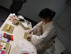 Cooking demonstration of futomaki matsuri sushi (thick festive sushi roll)