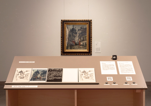 展示された佐伯祐三の油彩画《サンタンヌ教会》とその鑑賞支援教材(立体コピーや点字解説文、音声ガイド等)撮影:松原豊